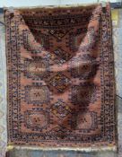 Eastern red ground rug with one row of three hooked lozenges and two rows of four hooked elephant