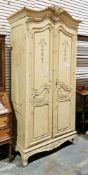 19th century style French cream painted armoire or wardrobe, the arched top with foliate scroll