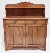 Late Victorian/early Edwardian oak chiffonier, the shelved top tier on turned supports, a base of