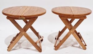 Pair of David Craig of Durham oak folding small tables, the circular tops folding in two, on an x-