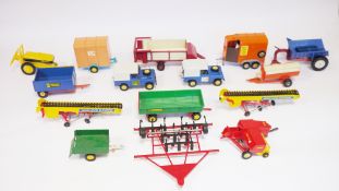 Quantity of Britains playworn farming accessories to include horse trailers, ploughs, two S.W.B land