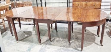Georgian mahogany D-end dining table having three central leaves on square tapering supports and