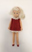 Pedigree Sindy Betsy doll, circa 1977, with blonde hair, blue eyes, wearing a red dress, white