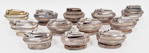 Collection of twenty-four mid century Ronson silver plated table lighters in the Queen Anne