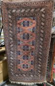 Eastern rust coloured ground rug with five central geometric medallions on geometric pattern