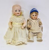 Kestner bisque headed baby doll, no.142, with pale blue sleeping eyes, composition body, 29.5cm