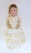 Jutta 1914 bisque headed doll with blue sleeping eyes, moulded upper teeth, with lace bonnet and