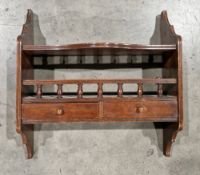 19th century mahogany hanging shelf, the shaped sides supporting two shelves, one with spindle