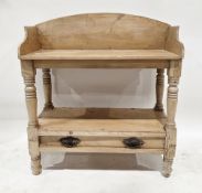 19th century pine washstand, the shaped back rail over a rectangular top, on turned legs united by