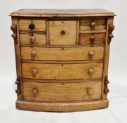 Victorian mahogany bow-fronted chest of drawers, comprising a central deep hat drawer flanked by