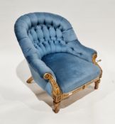 Victorian aesthetic movement carved walnut framed armchair, with blue button back upholstery, on