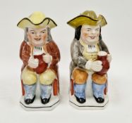 Two Staffordshire pearlware toby jugs and covers, early-mid 19th century, each modelled seated