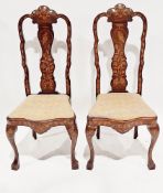 Pair of Dutch marquetry inlaid walnut dining chairs in the 18th century manner, the shaped central