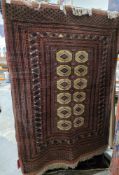 Persian style cream ground rug with two rows of six hooked lozenge medallions, multiple geometric