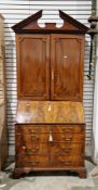 George III mahogany bureau cabinet, the top with architectural pediment, dentil cornices, fitted