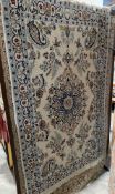 Persian style cream ground rug with central floral motif on floral field, boteh spandrels,