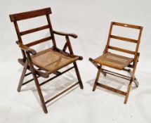 19th century child's beech and cane folding chair with X-frame, 66cm high x 39cm wide and another