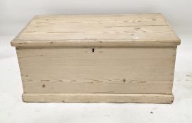 19th century pine blanket box, the hinged lid opening to a lidded candle box, on plinth base, with