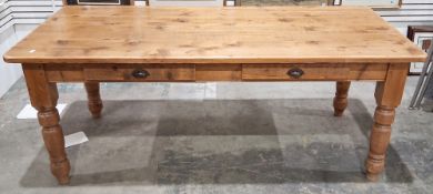 Pine dining table, the rectangular top with rounded corners, over two frieze side drawers with cup