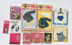 Five Pedigree Sindy carded clothes sets including a Patch blue check dress, a Paul swimming trunks