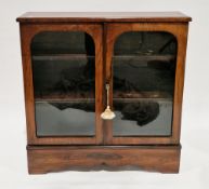19th century rosewood and cross-banded display cabinet, the twin arched glazed panel doors opening