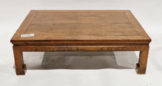 Chinese elm coffee table of rectangular form on square legs with carved scroll feet, 32cm high x