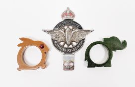 Two bakelite napkin rings, one green in the form of an elephant and the other brown in the form of a