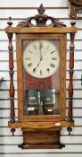 Early 20th century walnut and parquetry inlaid wall clock, the white face with Roman numerals and