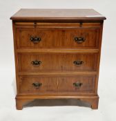 Modern yew wood veneered bachelors chest in the George III manner, comprising a brush slide over