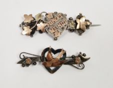 Two Victorian silver and gold-coloured bar brooches, one with a swallow and heart motif, the other
