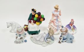 Group of Royal Doulton and Lladro figures, including: two Lladro clowns, a girl seated with ducks, a