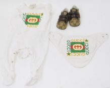 Gucci babygrow, size 3 to 6 months, with orange, green and red logo to front, with matching bid