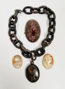 Victorian pressed horn necklace comprising an oval locket with monogram and a short belcher link