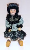 Large German bisque headed doll, impressed Germany 12, with fixed brown eyes, moulded upper teeth,