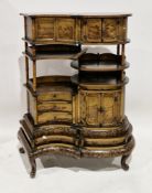 Japanese lacquered serpentine cabinet decorated with pavilions in mountainous lakeside landscapes,