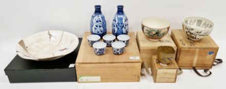20th century Japanese blue and white porcelain boxed sake set, with two faceted sake bottles and