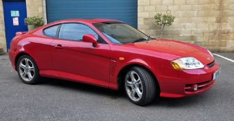 Hyundai coupe in red, 2.7 litre V6 petrol, manufactured and first registered in 2004, vehicle reg R6