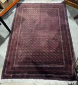 Eastern red ground rug with lozenge pattern field, multiple geometric borders, 208cm x 152cm