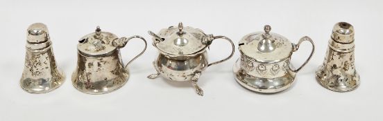 Collection of five silver condiment items including mustard pot with embossed tulip decoration and