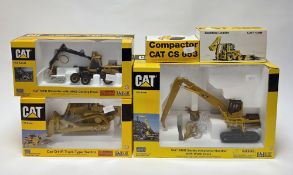 Three Norscot Scale Models boxed diecast models to include Cat 345B Series II Material Handler