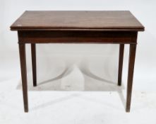 19th century mahogany fold-over tea table, the rectangular top on square tapering legs, 74cm high