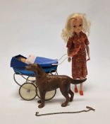 Sindy doll, circa 1980's with blonde hair and blue eyes, dressed in a red floral outfit with red