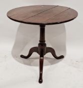 Georgian oak tilt-top tripod occasional table, circular on scroll supports, 67cm high x 73cm