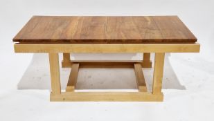 Hand-built walnut and white oak coffee table of contemporary design by A Channing, with a floating