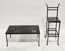 Contemporary industrial style bar stool and coffee table, each with a black metal frame, the table