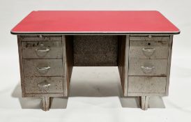Mid-century industrial metal tanker style twin pedestal desk, the rectangular top with red formica