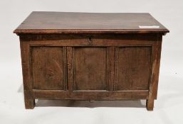 18th century oak coffer, the rectangular lid with thumb moulded edge, over a three panel front,