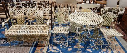 Cream finished metal garden suite comprising a table, two chairs and a bench, having a lattice and