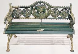 Cast metal garden bench in the Victorian style, the back with a central gundog motif flanked by