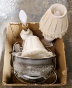 A pair of early 20th century pewter bowls with embossed floral decoration and white ceramic